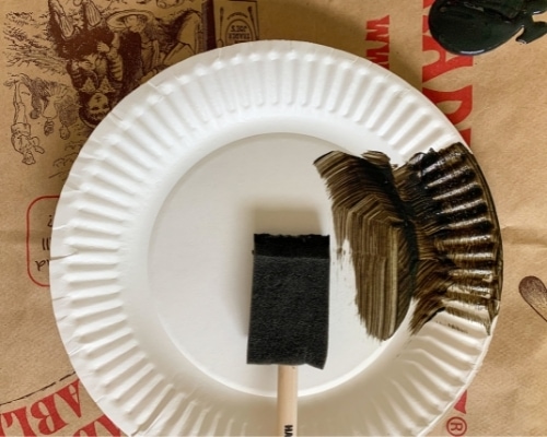 paper plate with black paint