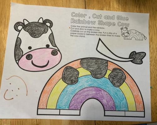 colored cow rainbow animal template on table