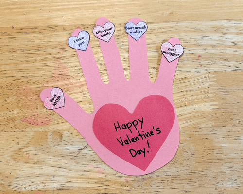 Valentines day handprint craft on table
