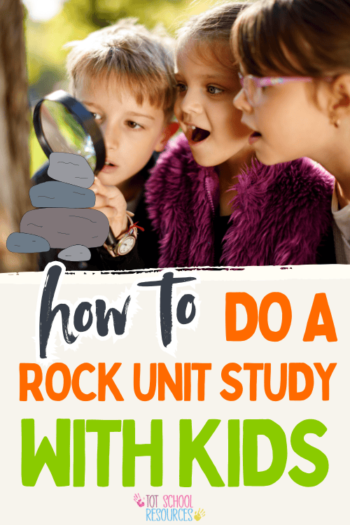 kids looking through a magnifying glass at rocks